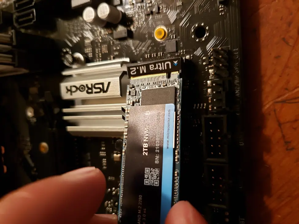 Sliding M.2 SSD into M.2 slot